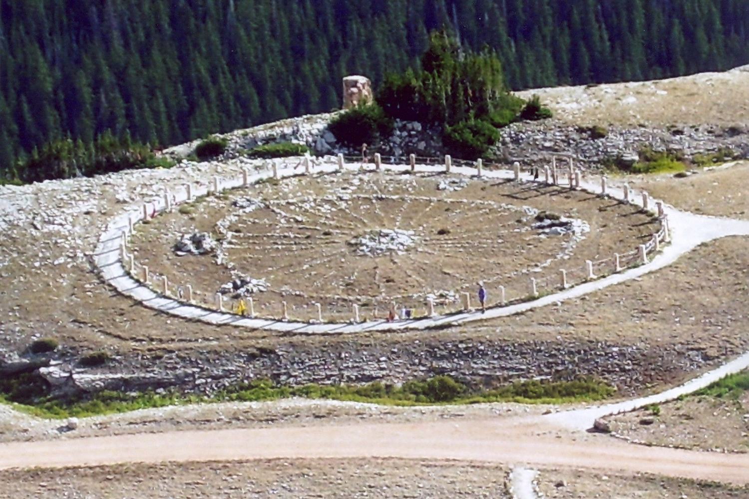 The stone spokes of the Medicine Wheel laid out on the mountain top, seen from above.